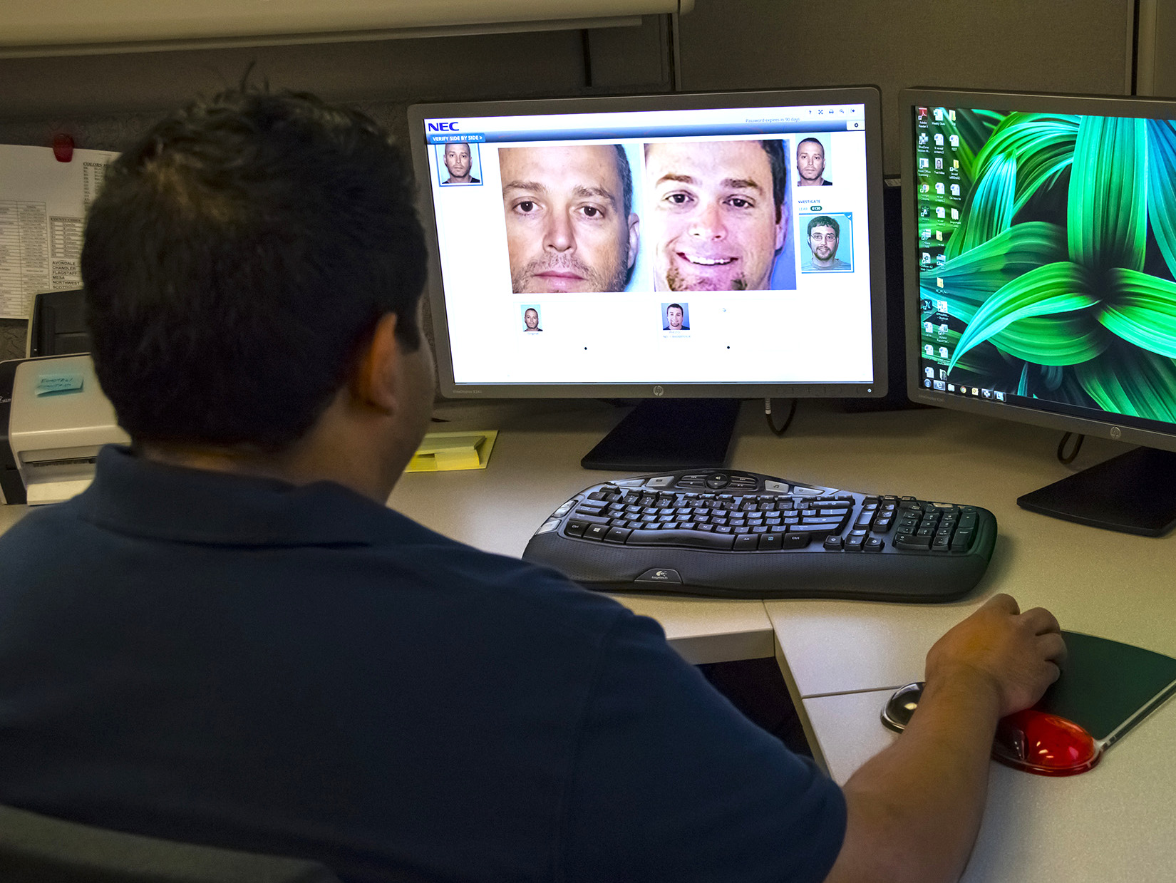 An analyst runs a facial image comparison on a computer